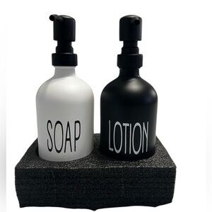 Black and White Soap and Lotion Dispenser Set. New